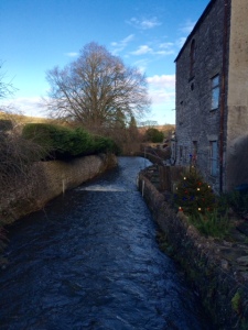 The stream that runs the village was swollen following the recent rainfall 